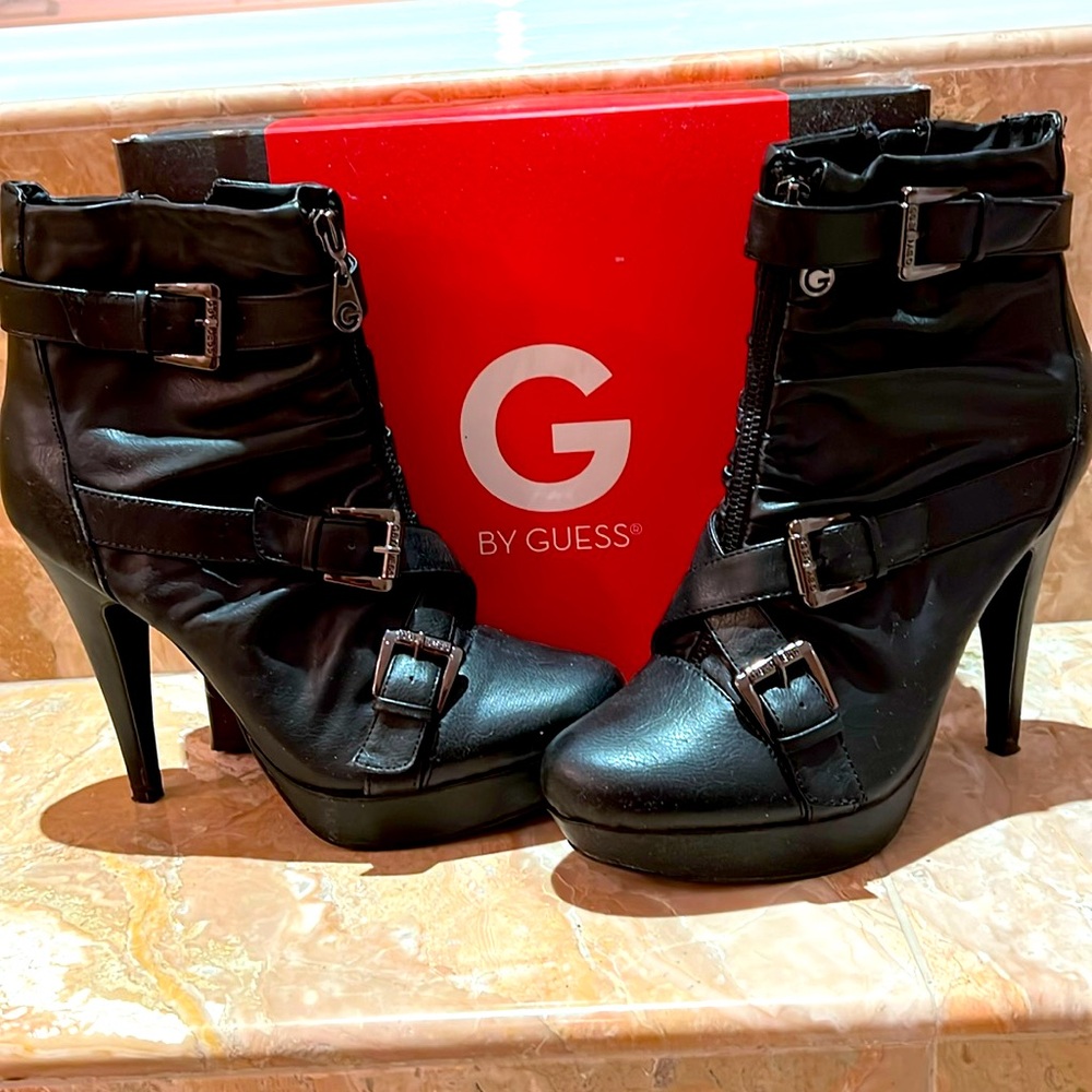 Guess Black platform heeled ankle high booties w/cross straps and zipper detail